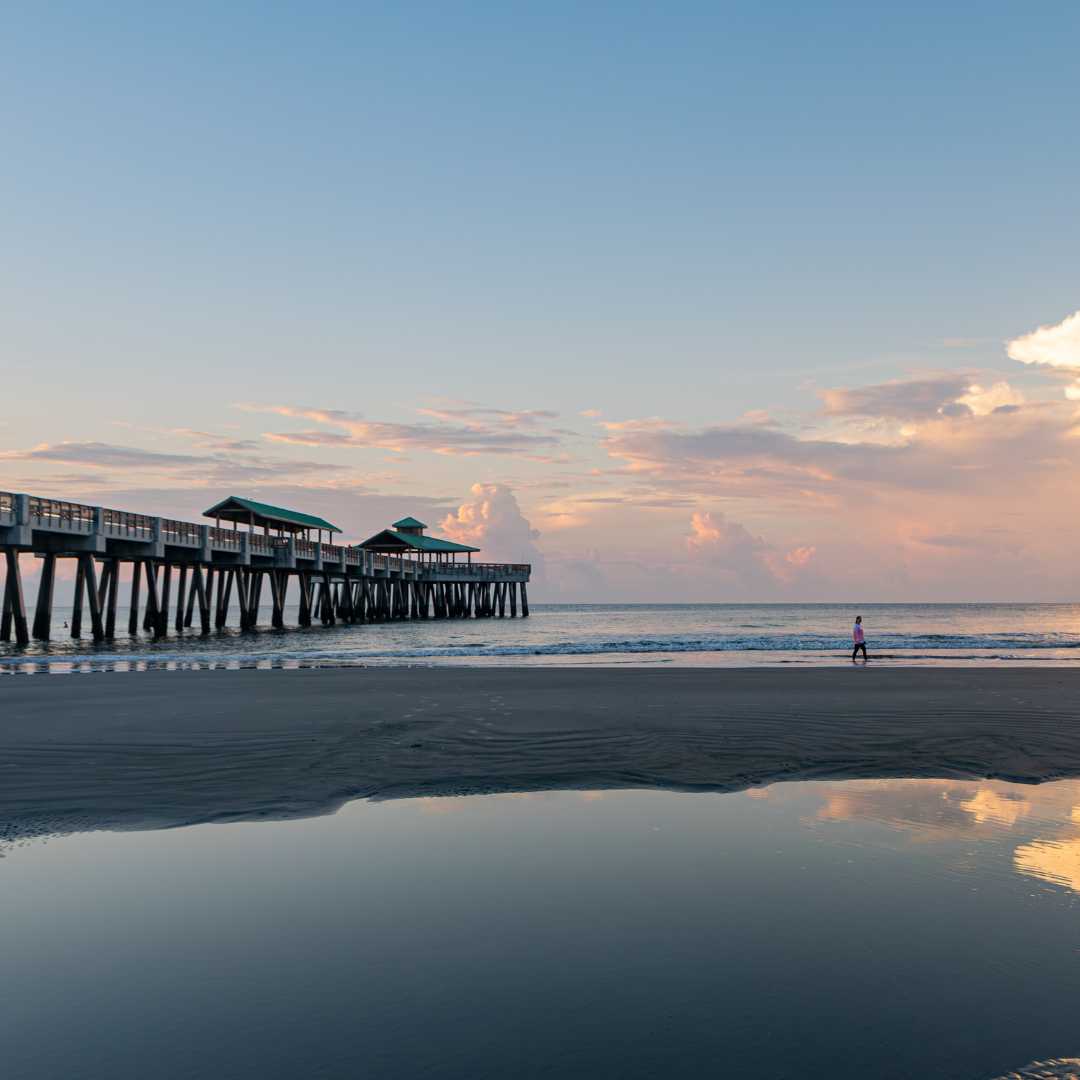 Sunset walk on the Folly Beach pier, just minutes from James Island neighborhoods.